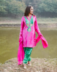 A women wearing pink and green colored Kurta Set with Dupatta.