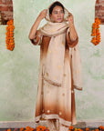 A women wearing beige and brown colored Kurta Set with Dupatta.