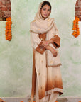 A women wearing beige and brown colored Kurta Set with Dupatta.