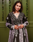 A women wearing black and grey Chanderi silk Anarkali kurta set.