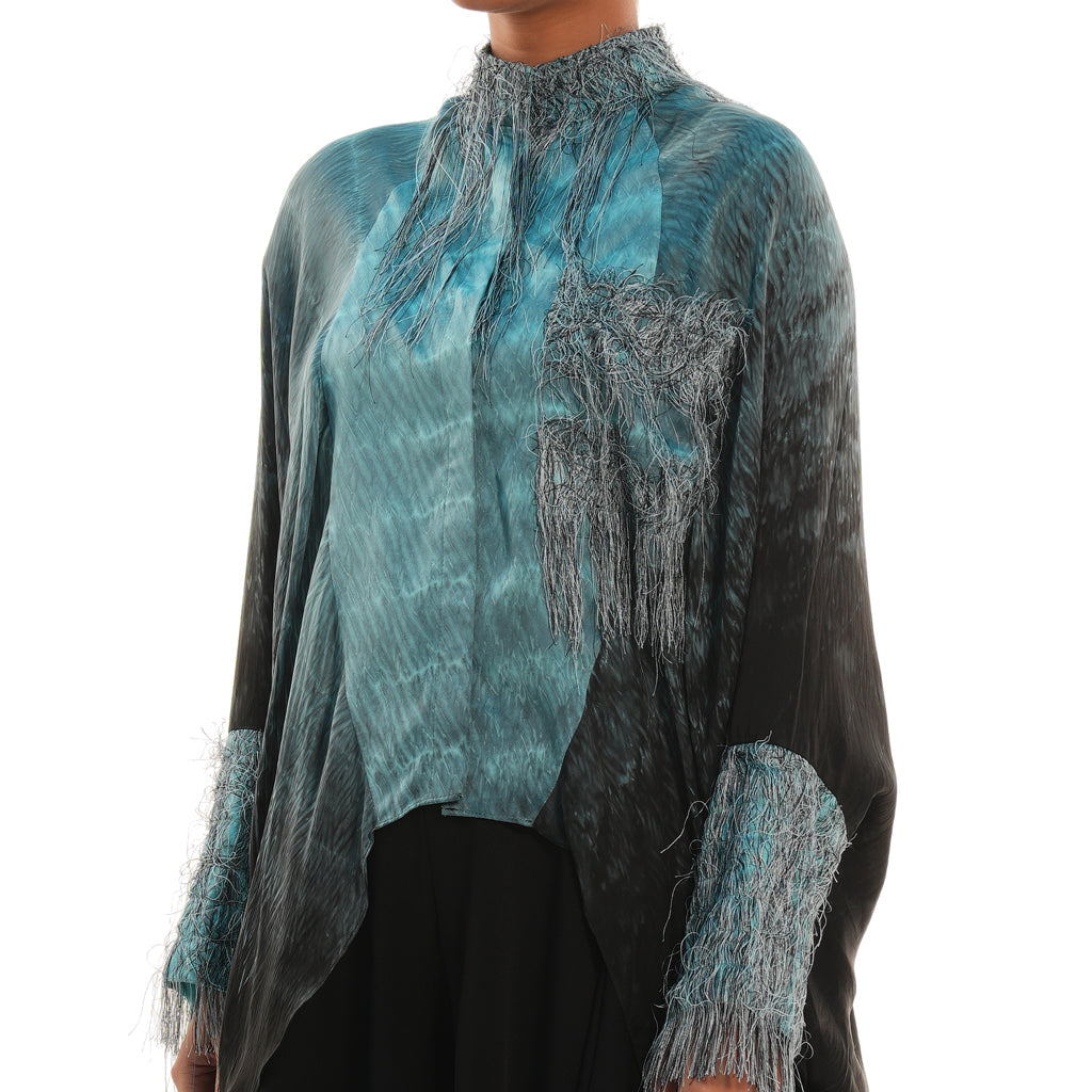 A woman wearing blue and black colored co-ord set with full sleeves.