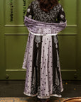 A women wearing black and grey Chanderi silk Anarkali kurta set.