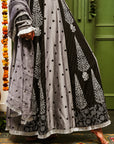 A women wearing black and grey Chanderi silk Anarkali kurta set.