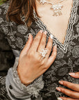 A women wearing black and grey Chanderi silk Anarkali kurta set.
