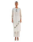 A women wearing designer white kurta set.