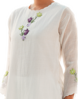 A women wearing designer white kurta set.