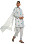 A women wearing White Kurta Set with blue colored floral print on it with Dupatta.