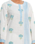 A women wearing White Kurta Set with blue colored floral print on it.