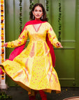 A women wearing yellow and pick Chanderi silk Anarkali kurta set with Pink Dupatta.