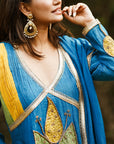 A women wearing Blue Kurta Set with Dupatta.