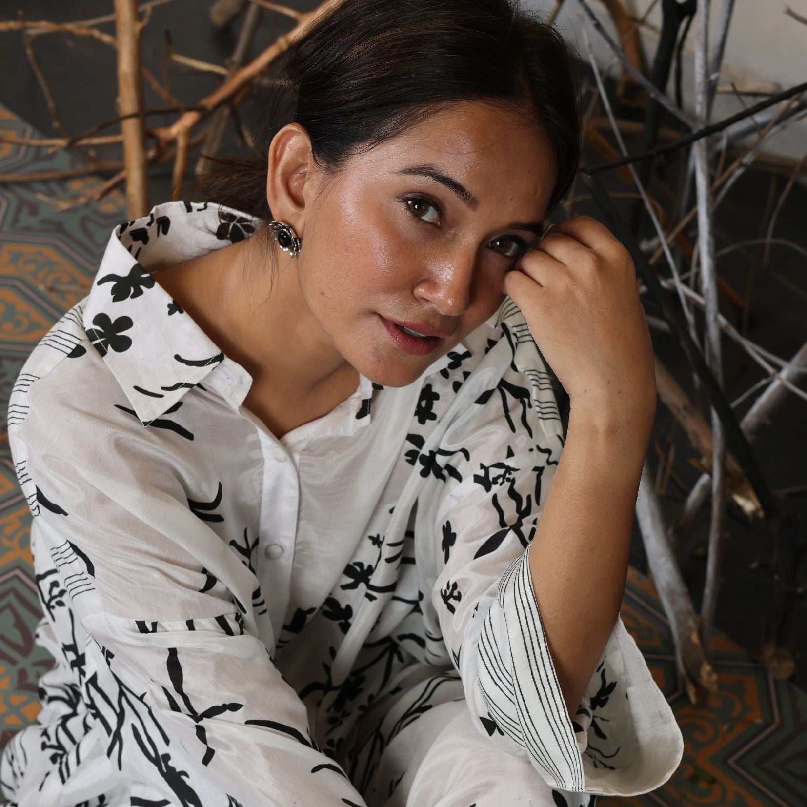 A woman sitting on the floor wearing Black and White Silk Co-Ord Set.