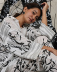 A woman sitting on the floor wearing Black and White Silk Co-Ord Set.