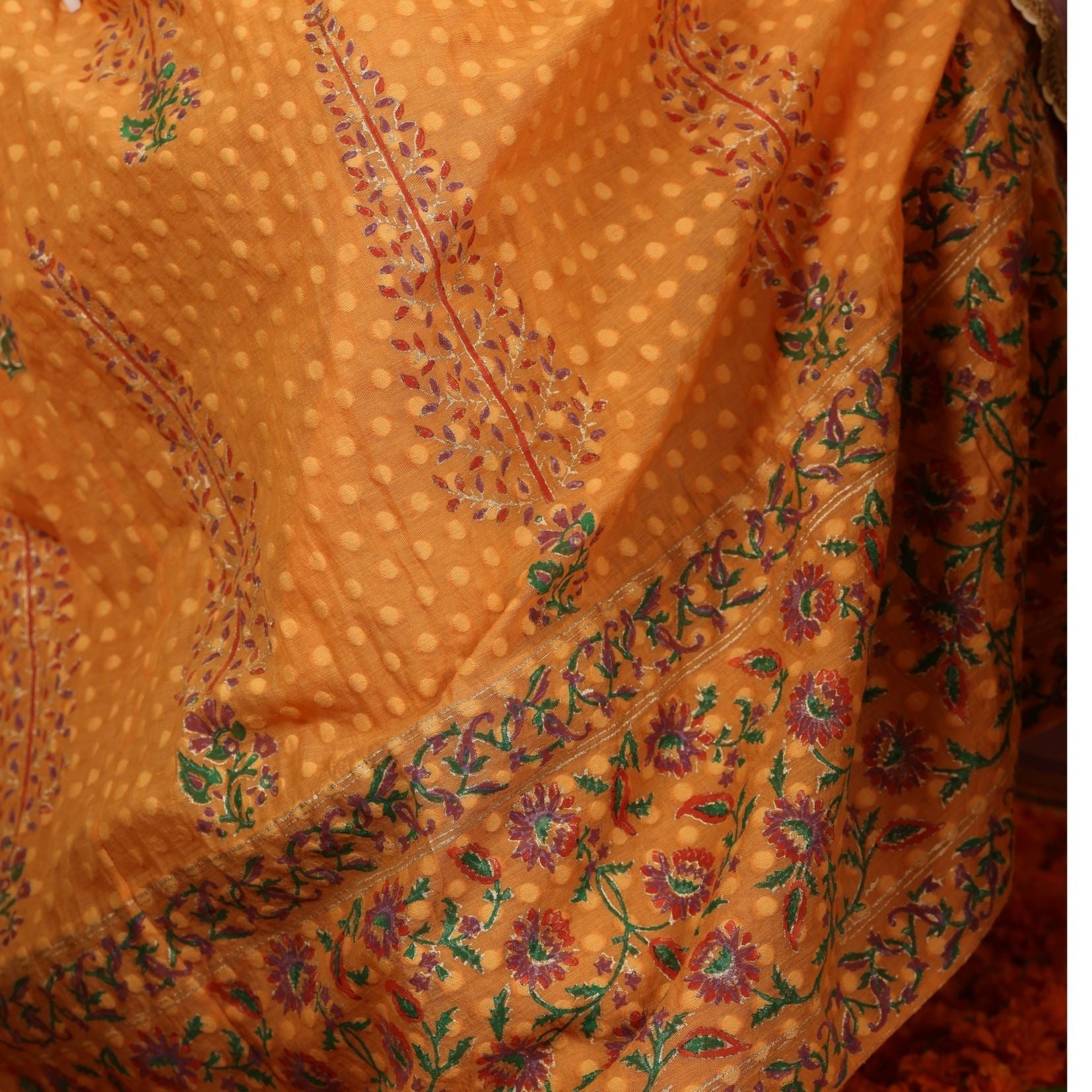 A women wearing Orange Anarkali Kurta Set with Purple Dupatta.