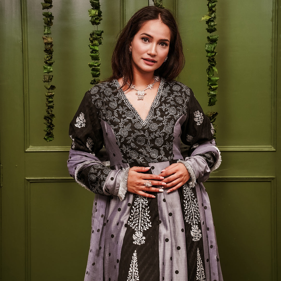 A women wearing black and grey Chanderi silk Anarkali kurta set.