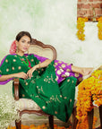 A women sitting on a chair wearing Kaftan Kurta Set of green and purple colour.