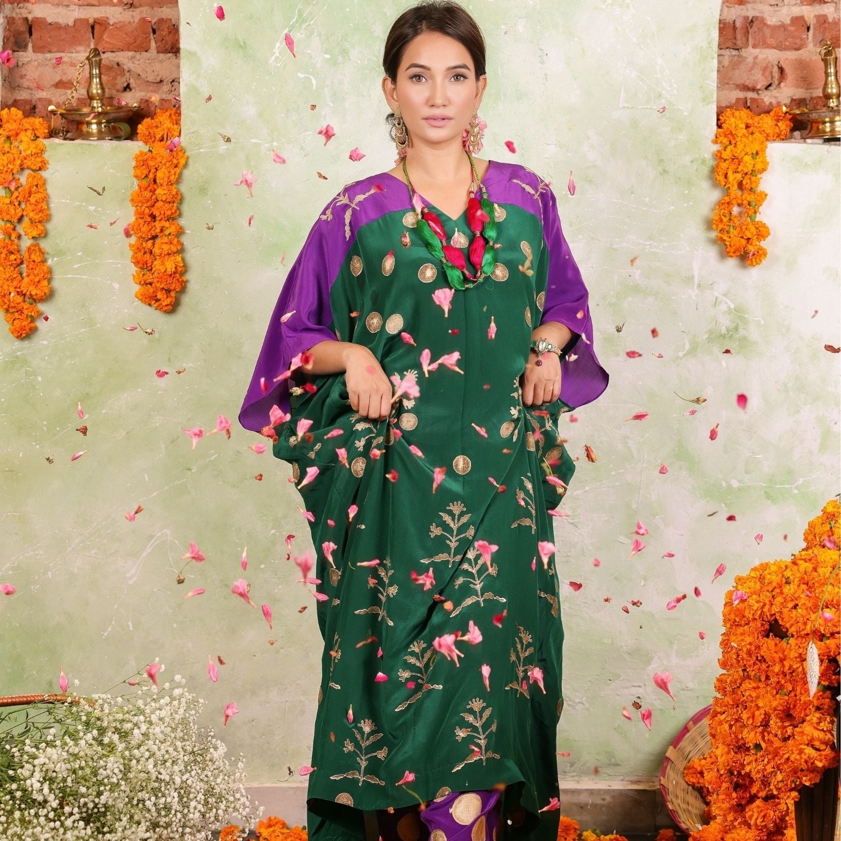 A women wearing Kaftan Kurta Set of green and purple colour.