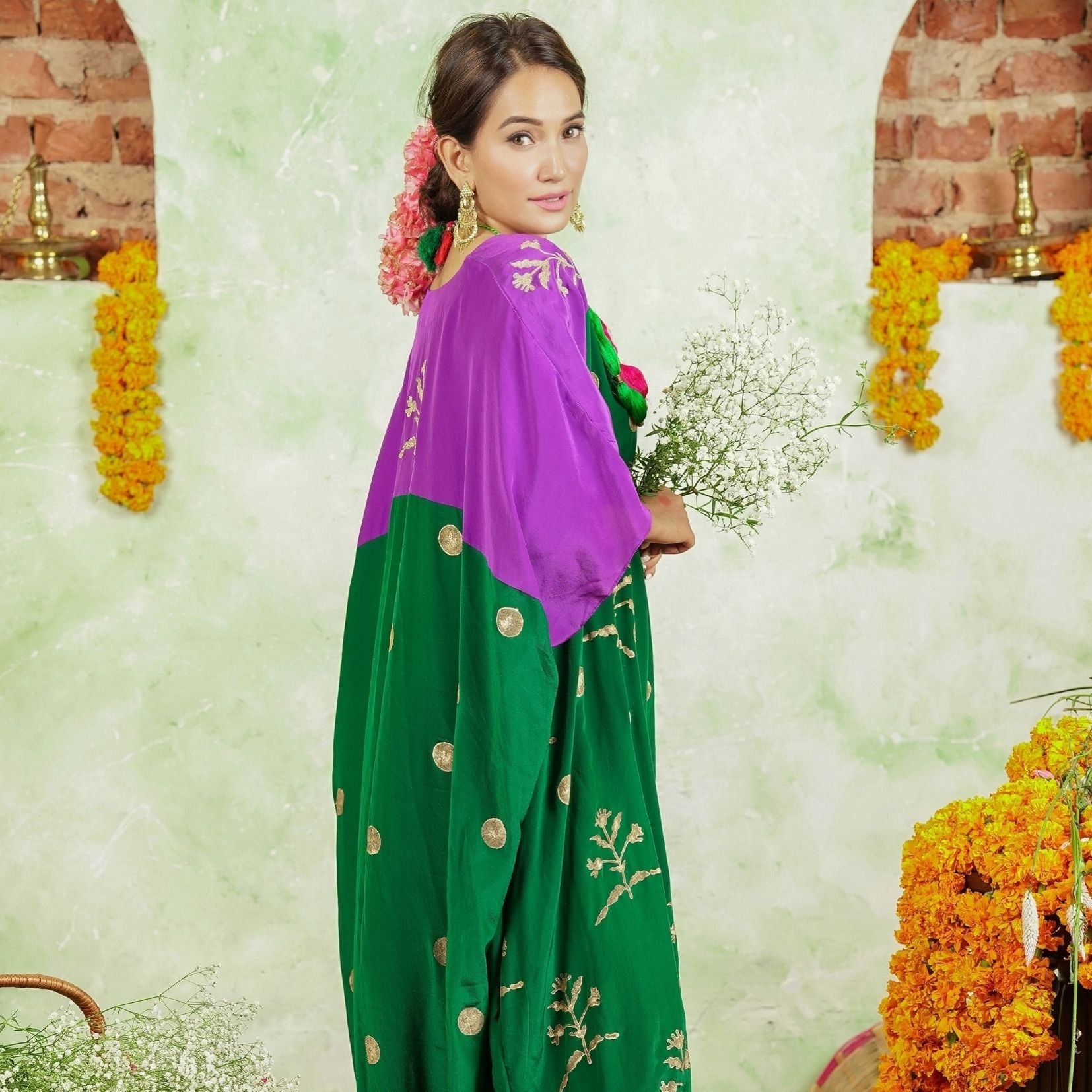 A women wearing Kaftan Kurta Set of green and purple colour.