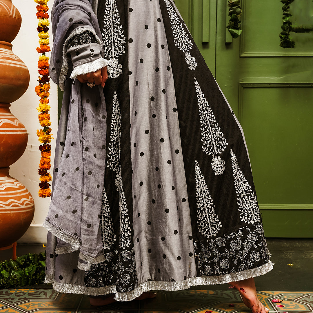 A women wearing black and grey Chanderi silk Anarkali kurta set.