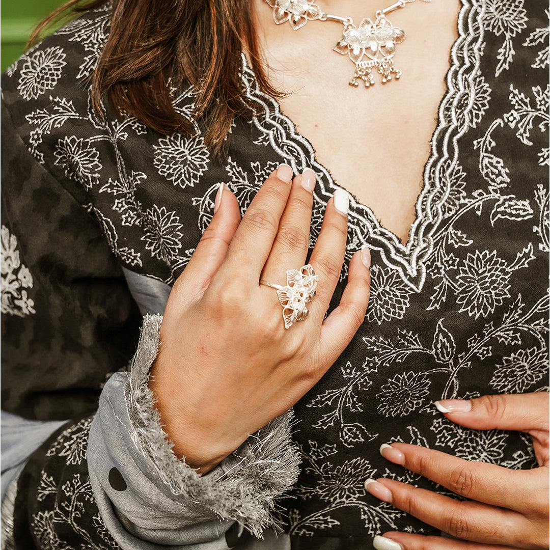 A women wearing black and grey Chanderi silk Anarkali kurta set.