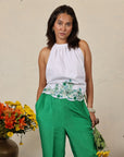 A woman wearing white and green colored co-ord set.