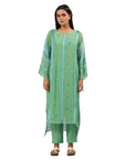 A women wearing Green Kurta Set with pants.