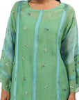 A women wearing Green Kurta Set with pants.