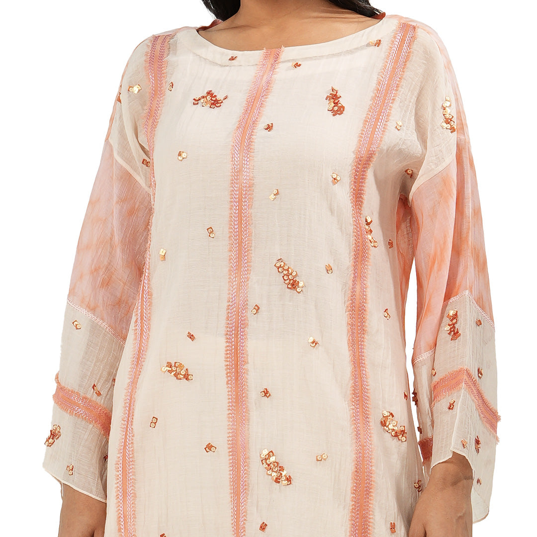 A women wearing Peach Colored Kurta Set.