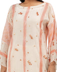 A women wearing Peach Colored Kurta Set.