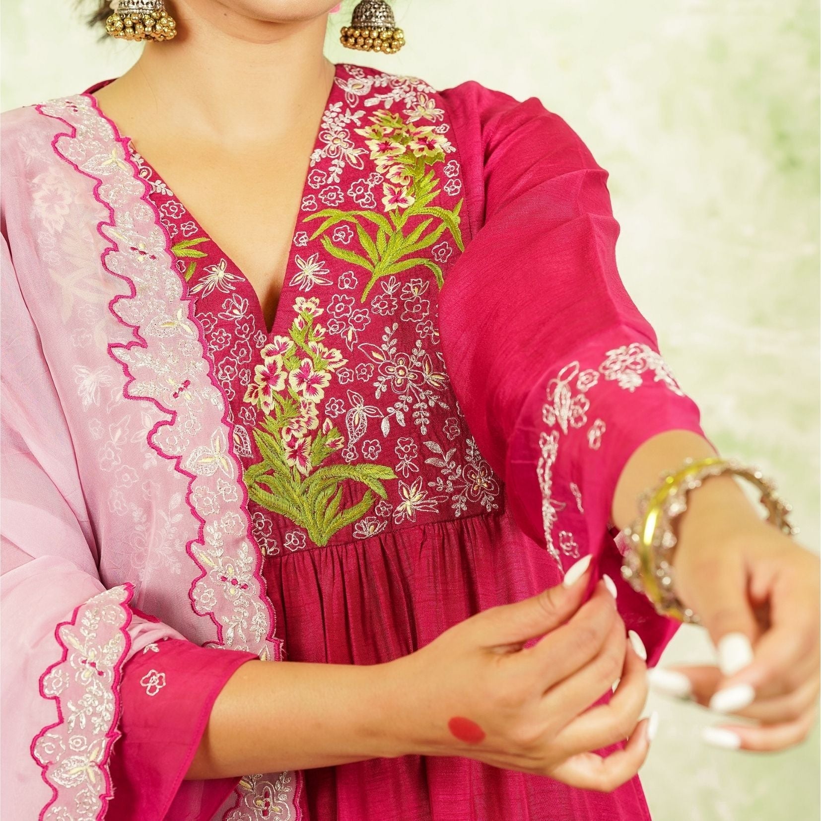 A woman wearing Pink Colored Silk Kurta Set with Organza Dupatta.