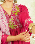 A woman wearing Pink Colored Silk Kurta Set with Organza Dupatta.