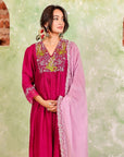 A woman wearing Pink Colored Silk Kurta Set with Organza Dupatta.