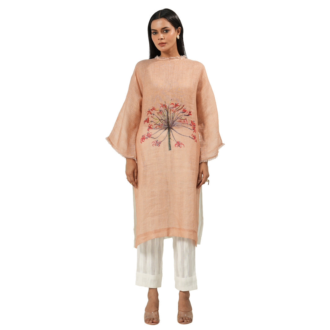 A women wearing stylish full sleeves pink kurta set with white pants.