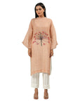 A women wearing stylish full sleeves pink kurta set with white pants.