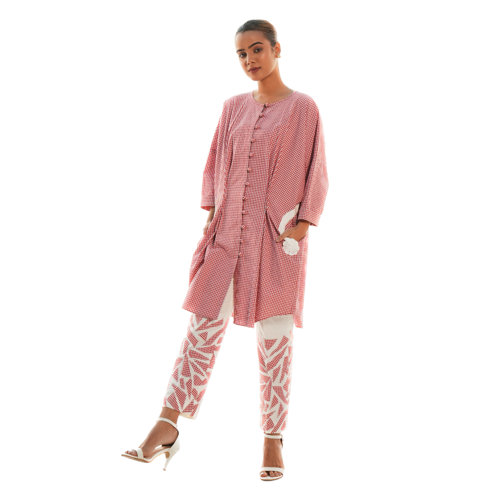 A women wearing beautiful pink and white co-ord set with full sleeves.