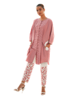 A women wearing beautiful pink and white co-ord set with full sleeves.