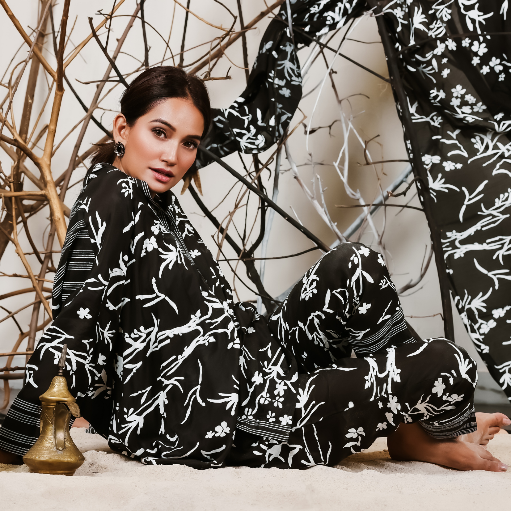 A woman sitting on the floor wearing Black and White Silk Co-Ord Set.