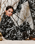 A woman sitting on the floor wearing Black and White Silk Co-Ord Set.