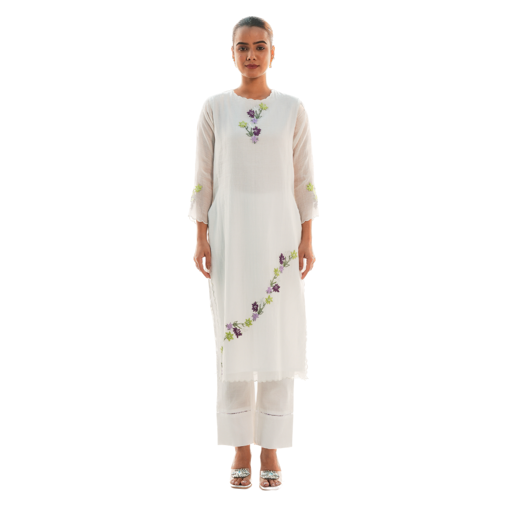 A women wearing designer white kurta set.