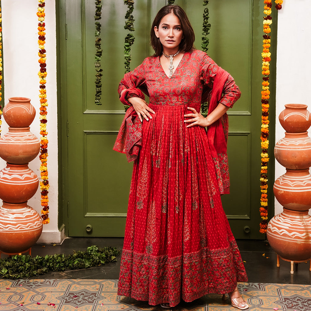 A women wearing Red Anarkali Suit Set with Dupatta.