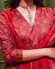 A women wearing Red Anarkali Suit Set with Dupatta.