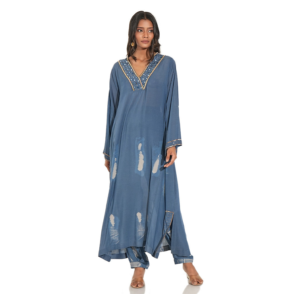 A women wearing blue colored cotton kurta set with full sleeves.