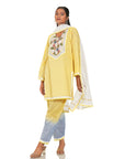 A women wearing yellow colored kurta set with yellow and blue pants with white dupatta.