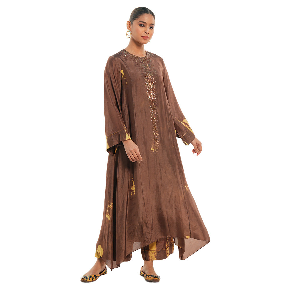 A woman wearing brown colored Kaftan Kurta Set.