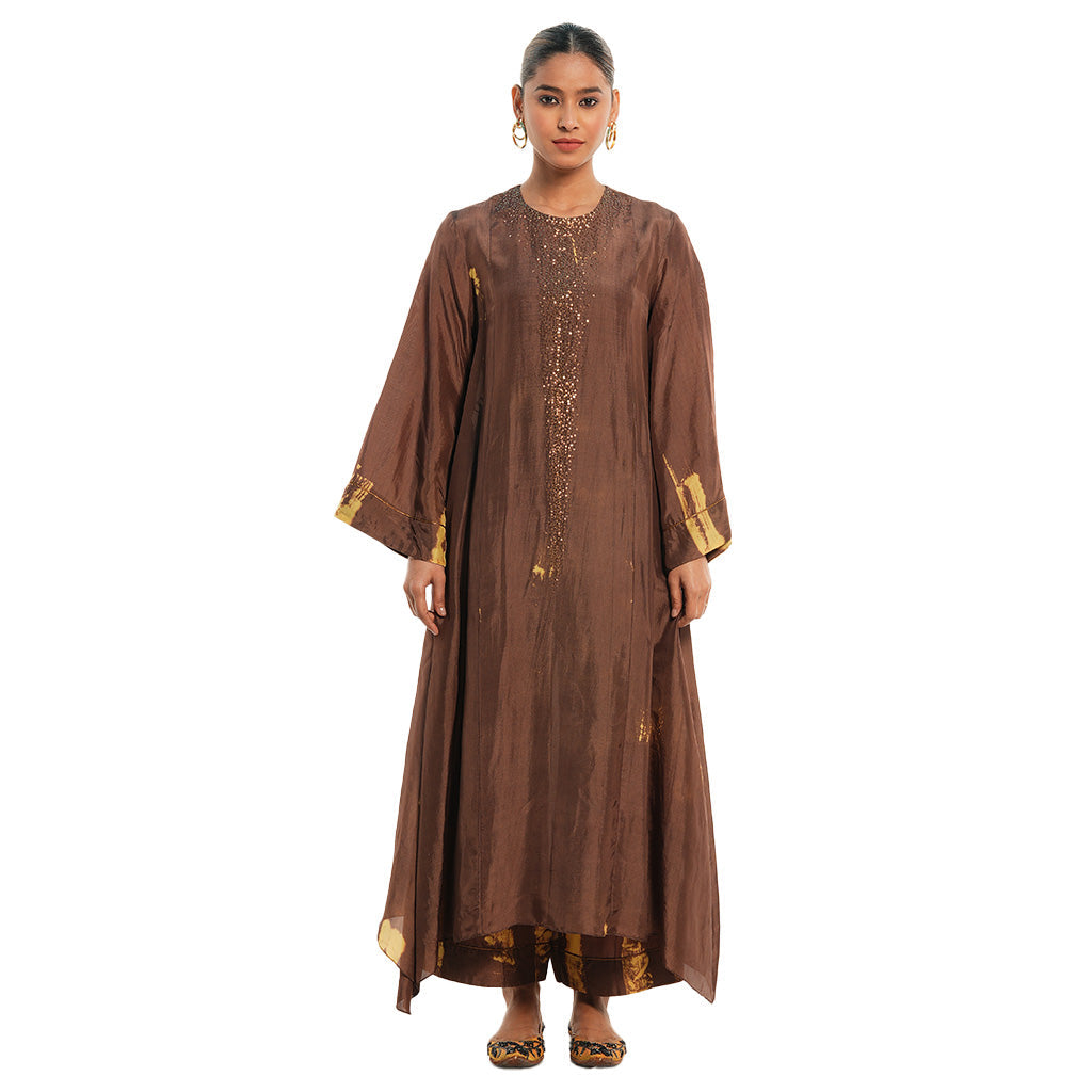 A woman wearing brown colored Kaftan Kurta Set.