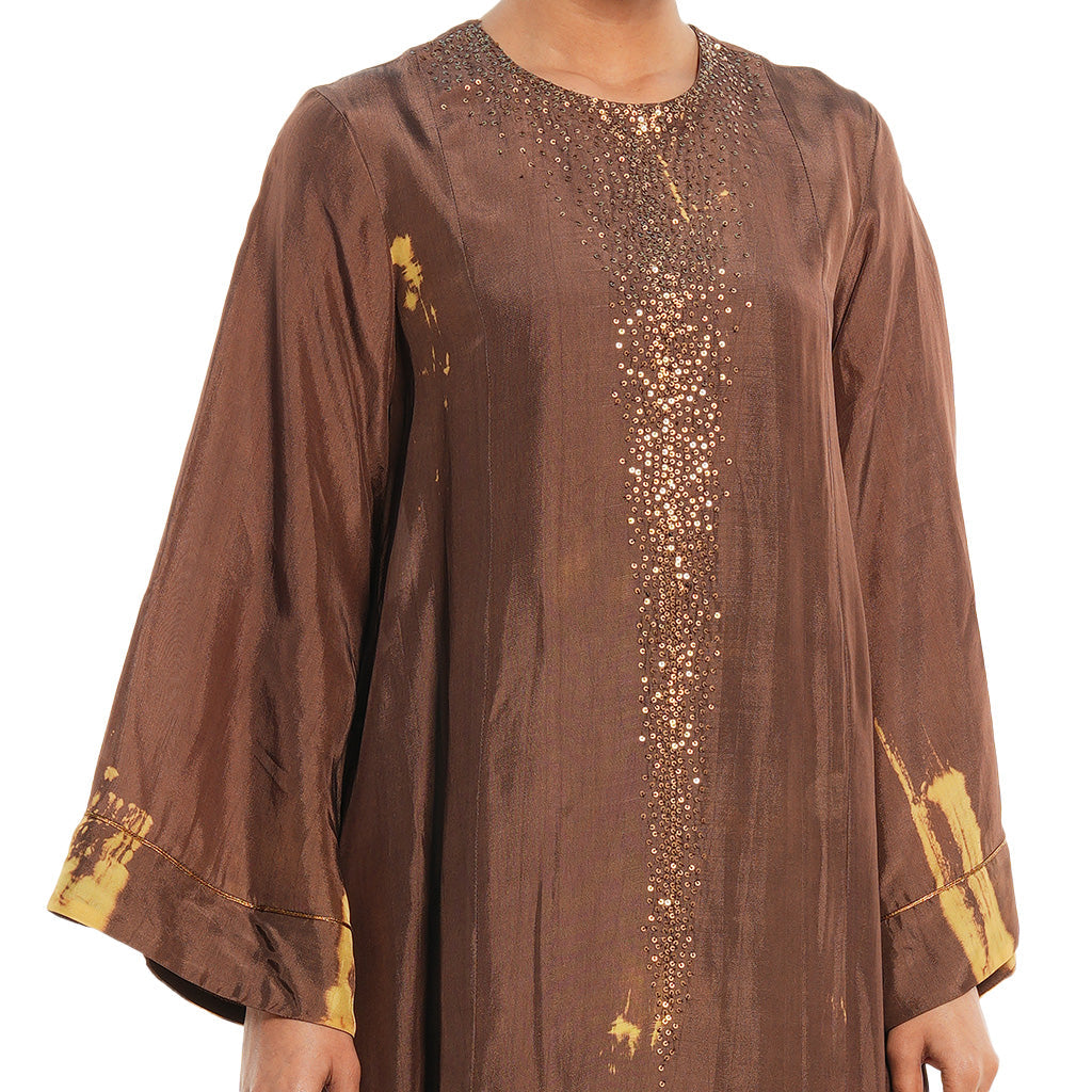 A woman wearing brown colored Kaftan Kurta Set.