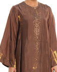 A woman wearing brown colored Kaftan Kurta Set.