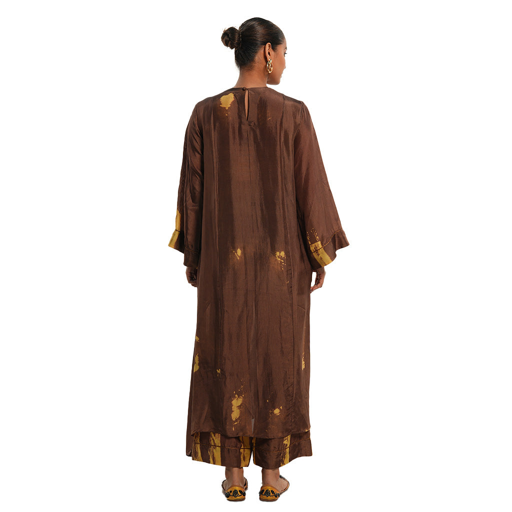 A woman wearing brown colored Kaftan Kurta Set.