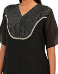 A women wearing Black Kurta Set.