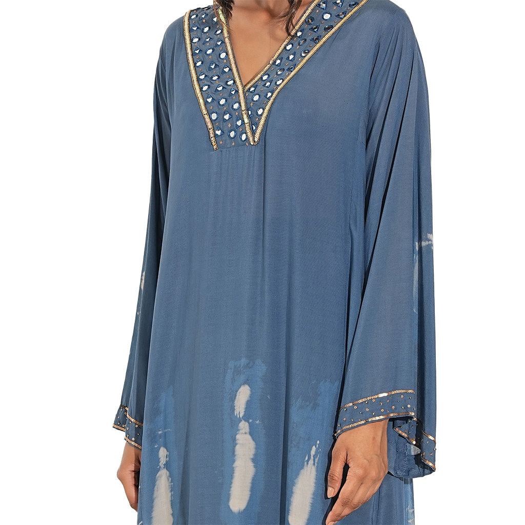 A women wearing blue colored cotton kurta set with full sleeves.