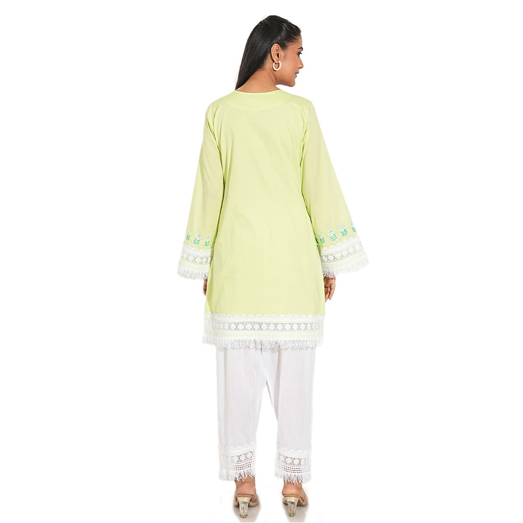 A women wearing light yellow kurta set with white embroidery on it with white pants.